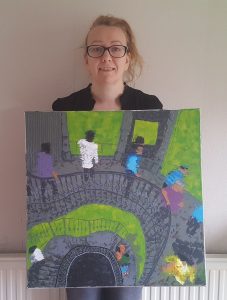 Emma with one of her paintings